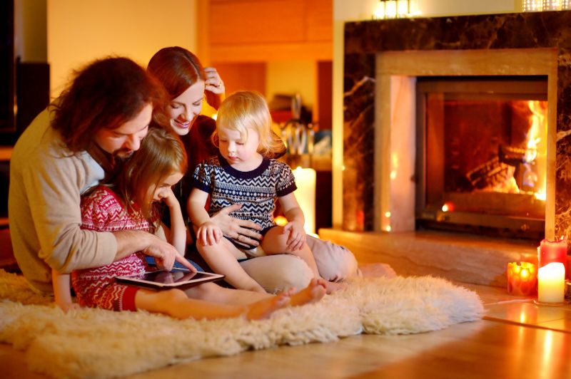 Happy young family using tablet pc | Alternative heat sources for power outages