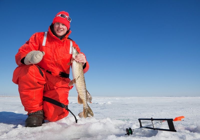 Ice fisherman holding northern pike | Camping Near Valentine NE | Valentine Nebraska