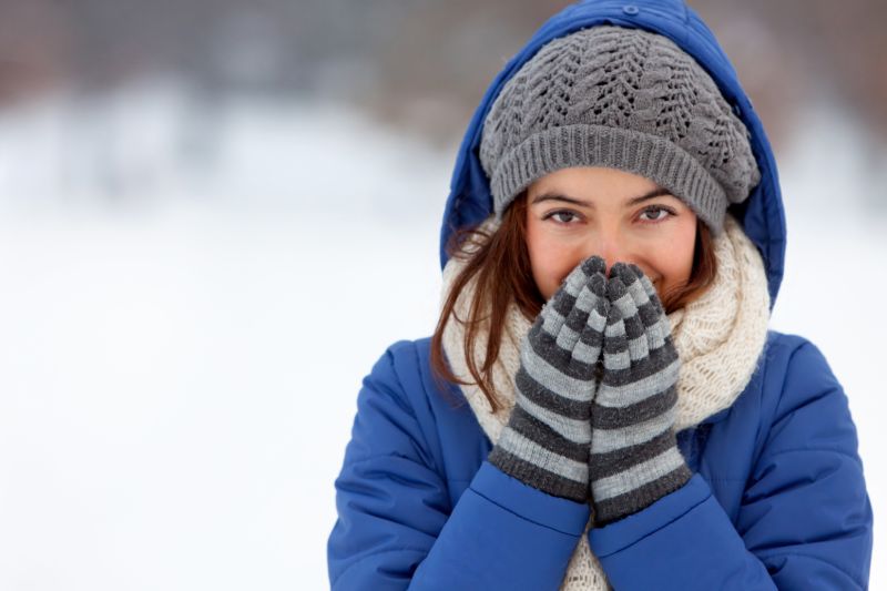 Portrait woman feeling cold winter outdoors | Alternative heat sources for power outages