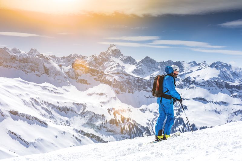 Skier enjoying panoramic view | Avalanche airbag