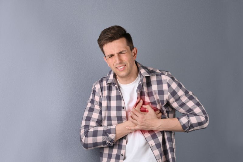 Young man having heart attack on | Heart attack survival rate