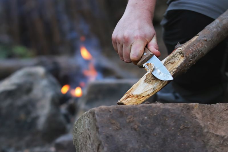 close-hands-man-carving-off-timber Warrior 