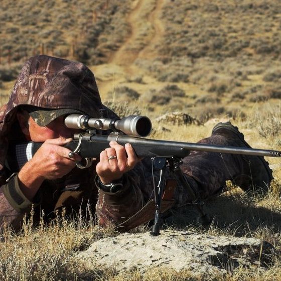 close image male shooting rifle taken Gun for Bear Hunting | Featured Image
