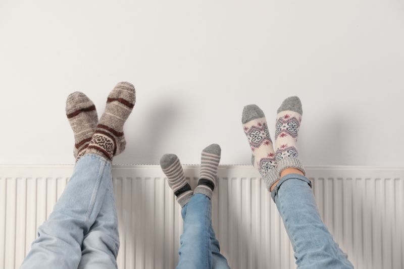 family-warming-legs-on-heating-radiator Emergency Heating 