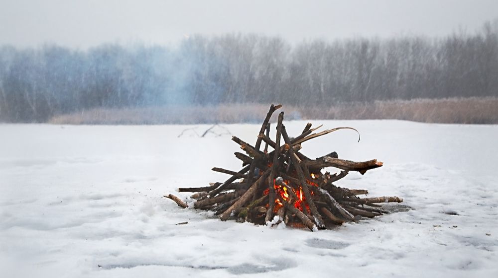 fire-falling-snow-on-frozen-lake Uses for Snow | FEATURED IMAGE