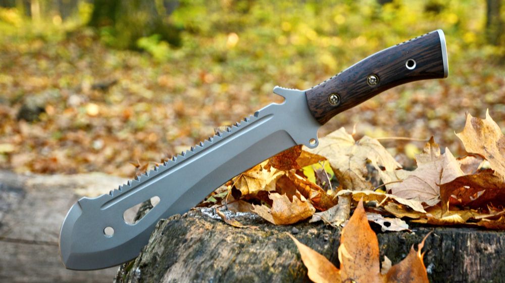 machete-stuck-stump best survival machetes | FEATURED IMAGE