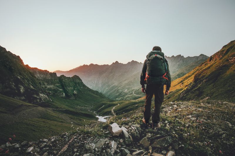 man-hiking-sunset-mountains-heavy-backpack Out Back with Jack