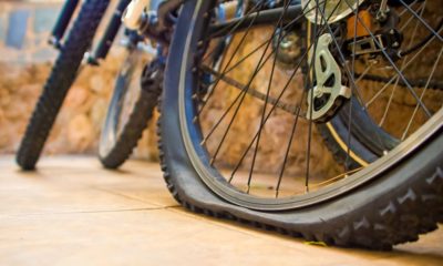 two-bicycles-yard-one-flat-tyre How To Fix a Flat Bike Tire | Featured Image