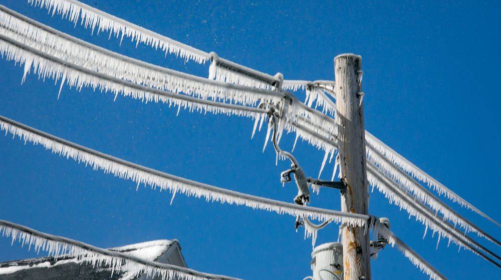 utility-pole-wires-covered-ice How to Keep Warm Without Electricity | FEATURED IMAGE