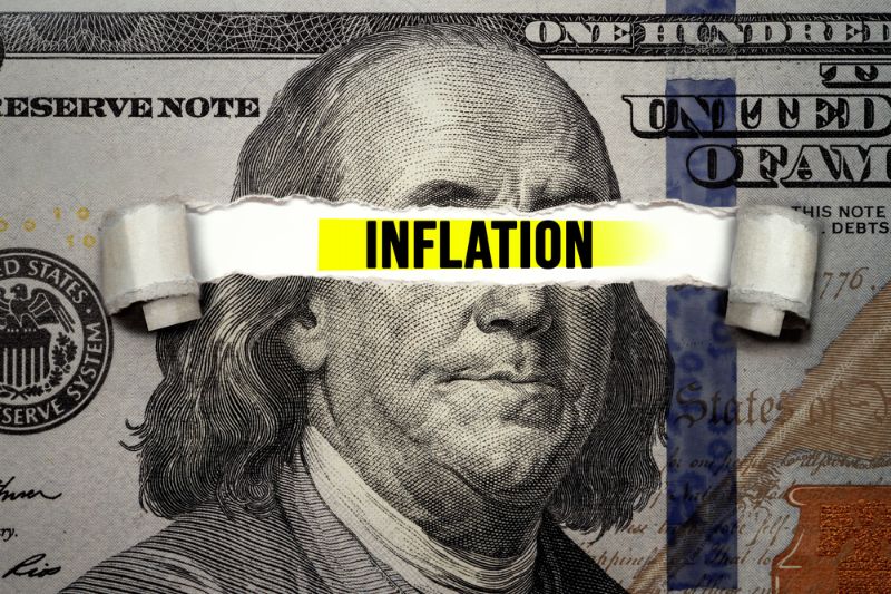 torn bills revealing inflation words idea Inflation On The Rise