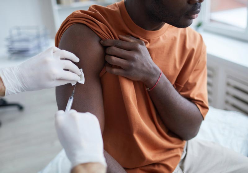 black man getting vaccine | Get Vaccinated | How to Survive north Korea 