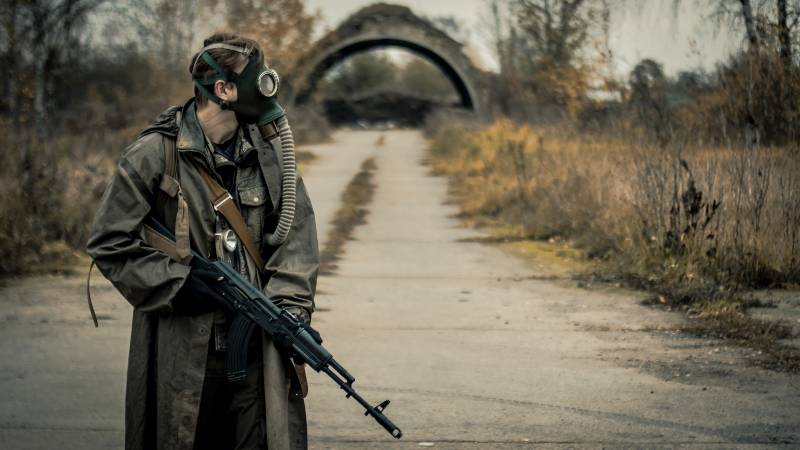 Survivor soldier in gas mask and with russian assault rifle | Step Eight: Have a Nuclear War Survival Backup Plan