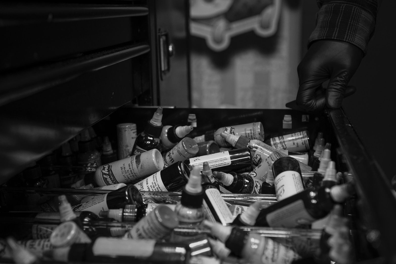 Advanced Prepper Supplies grayscale photography of drawer full of bottles