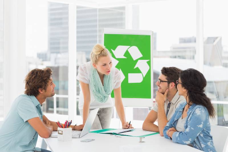 Casual team having meeting about eco policy in the bright office Environmental Policy ss 1