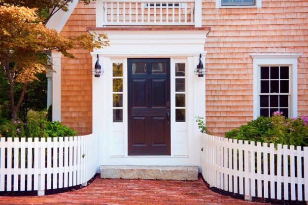 Perfect Spots To Set Up Your Home Security Cameras Entryway of brick New England home home security cameras getty 1