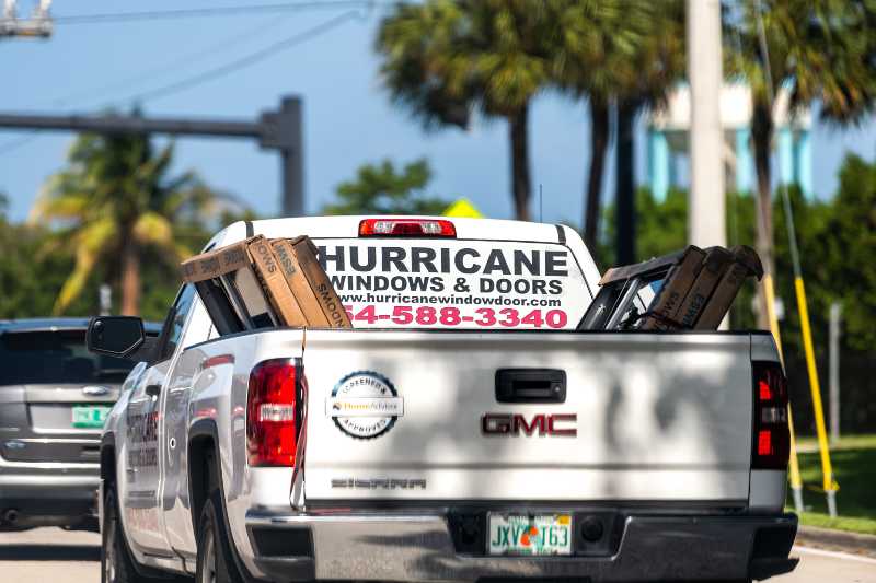 Hurricane windows and doors advertisement sign on truck service business company Hurricanes ss 1